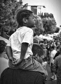 Rear view of people sitting outdoors