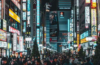 Crowd on city street at night