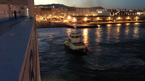 River with buildings in background at dusk