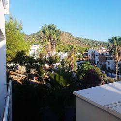 High angle view of townscape against clear blue sky