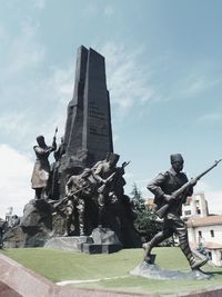 Statue of historic building against sky