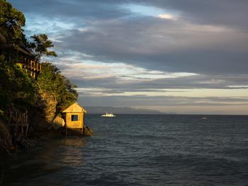 Scenic view of sea against cloudy sky