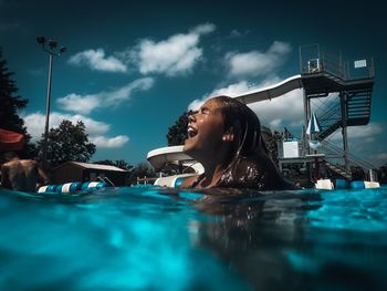 Portrait of man swimming in pool