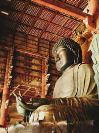 Low angle view of buddha statue