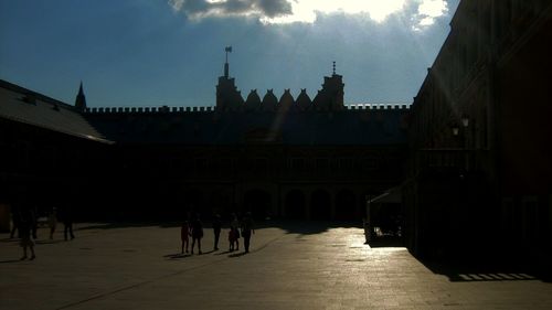 Tourists against clear sky