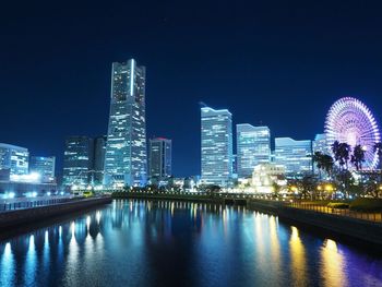 Illuminated city buildings at night