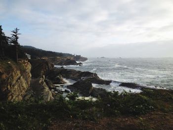 Scenic view of sea against cloudy sky