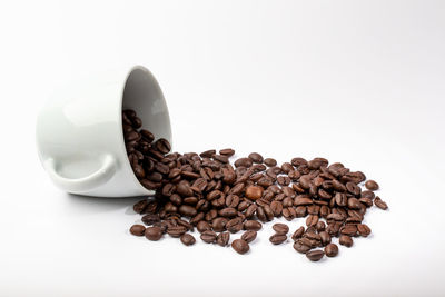 Close-up of coffee beans against white background