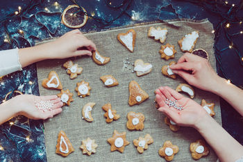 Close-up of hands making christmas cookies