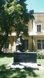Rear view of statue against building