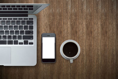 High angle view of coffee cup on table