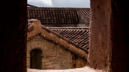 Low angle view of old building roof