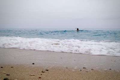 Scenic view of beach against clear sky