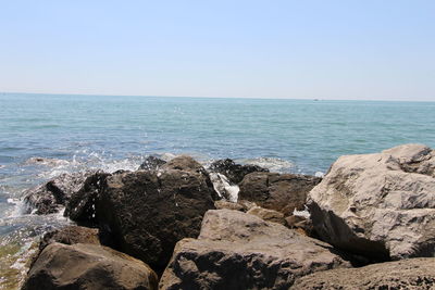 Scenic view of sea against clear sky