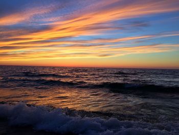 Scenic view of sea against sky at sunset