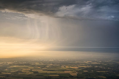 Aerial view of landscape and clouds at sunset