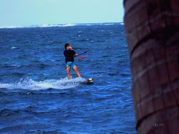 Full length of man standing in sea