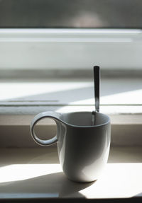 Close-up of coffee cup on table