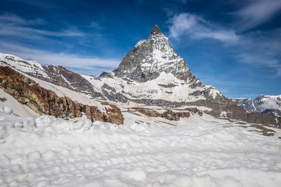 Snow covered mountain against sky