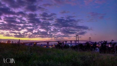 Panoramic view of bridge against sky at sunset