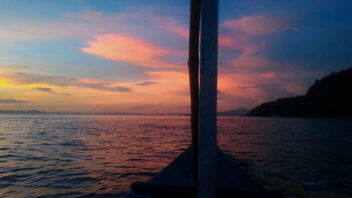 Close-up of sea against sky during sunset