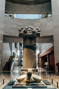 Low angle view of statue against building