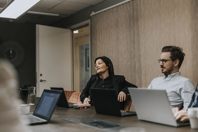 People sitting at business meeting