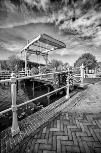 Built structure by footpath against sky