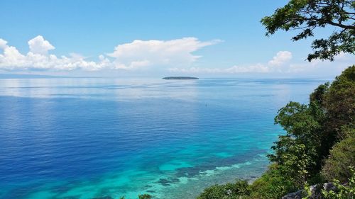 Scenic view of sea against cloudy sky