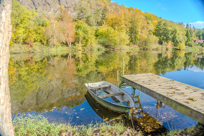 Boats moored in lake