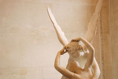 Marble sculpture called psyche revived by cupid's kiss on display in the louvre in paris, france.