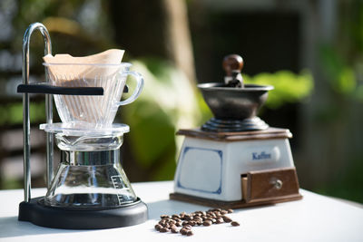 Close-up of coffee maker on table