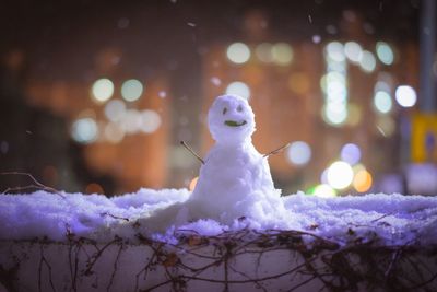 Close-up of snow on field during winter