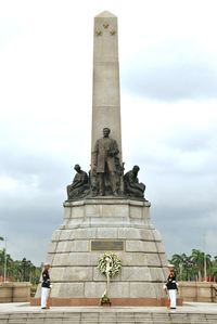 Low angle view of statue against sky