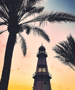 Low angle view of silhouette tower against sky during sunset