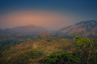Scenic view of mountains against sky during sunset