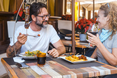 Friends having food at restaurant