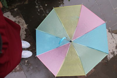 High angle view of person holding umbrella