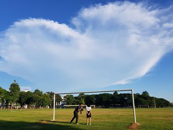 People on field against sky