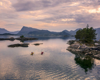 Scenic view of lake against sky during sunset
