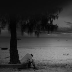 People relaxing on beach