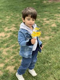 Full length of boy standing on field