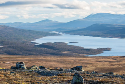 Scenic view of landscape and mountains against sky