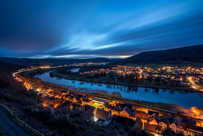 High angle view of illuminated city buildings at night