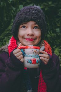 Portrait of a smiling young woman in winter