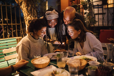 People sitting on table at restaurant