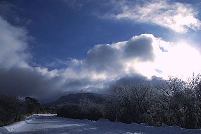 Scenic view of snow covered mountains against sky