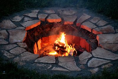 High angle view of fire burning in pit