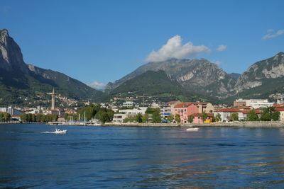 Scenic view of sea and mountains against sky