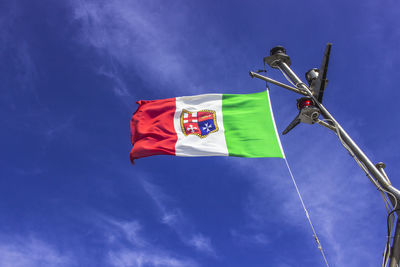 Low angle view of flag against sky